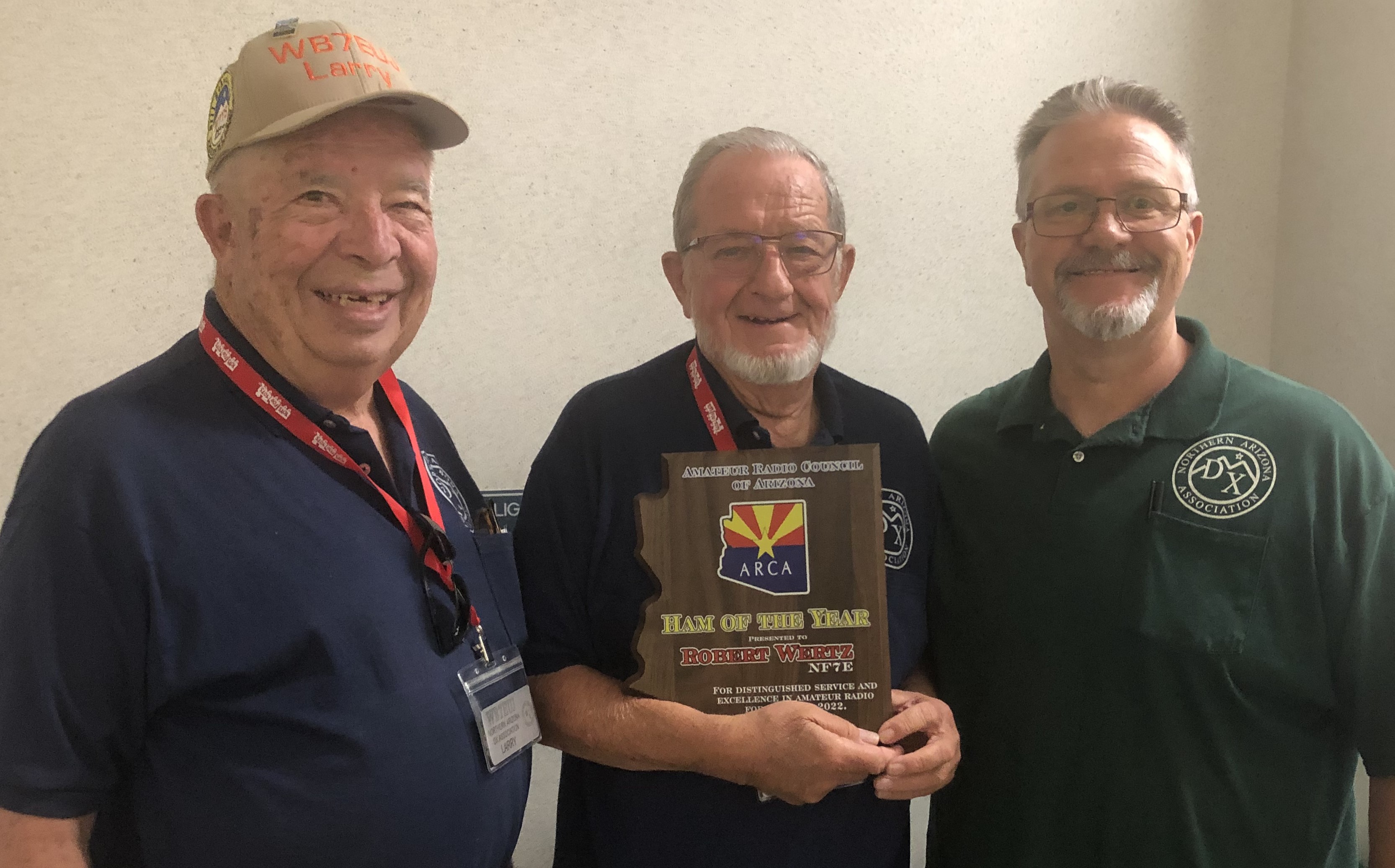 Photo of Bob Wertz receiving 2022 Ham of the Year award, with 
        Larry Gilbert and Mike Hanks